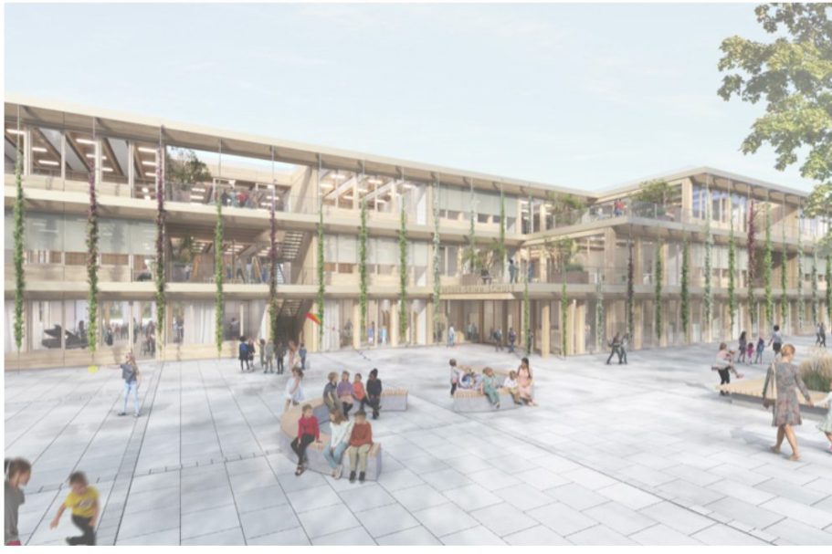 Baugebiet mit mehreren Gebäuden und einem Kran in einer ländlichen Umgebung.